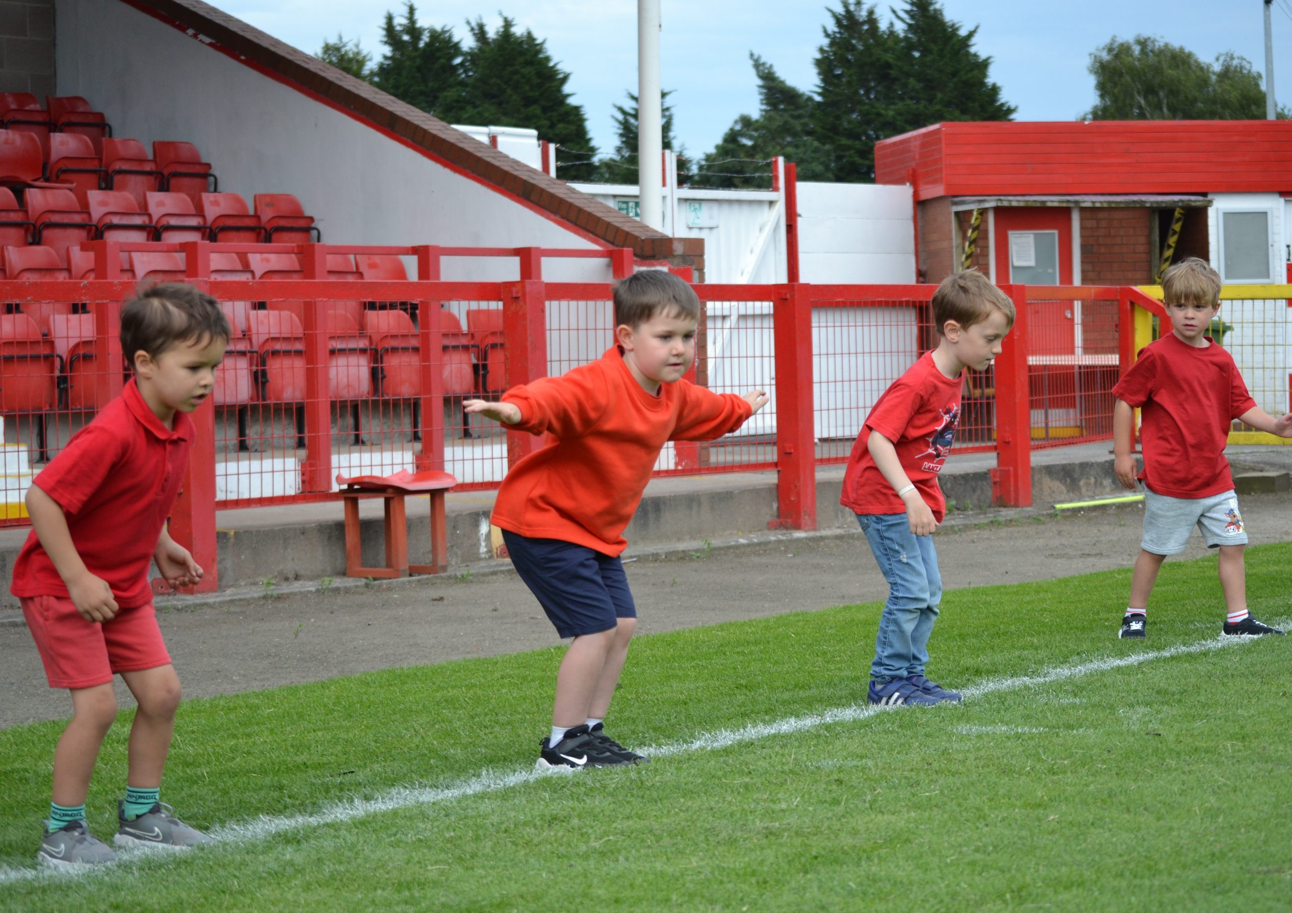 4 Squirrel Scouts getting ready to jump