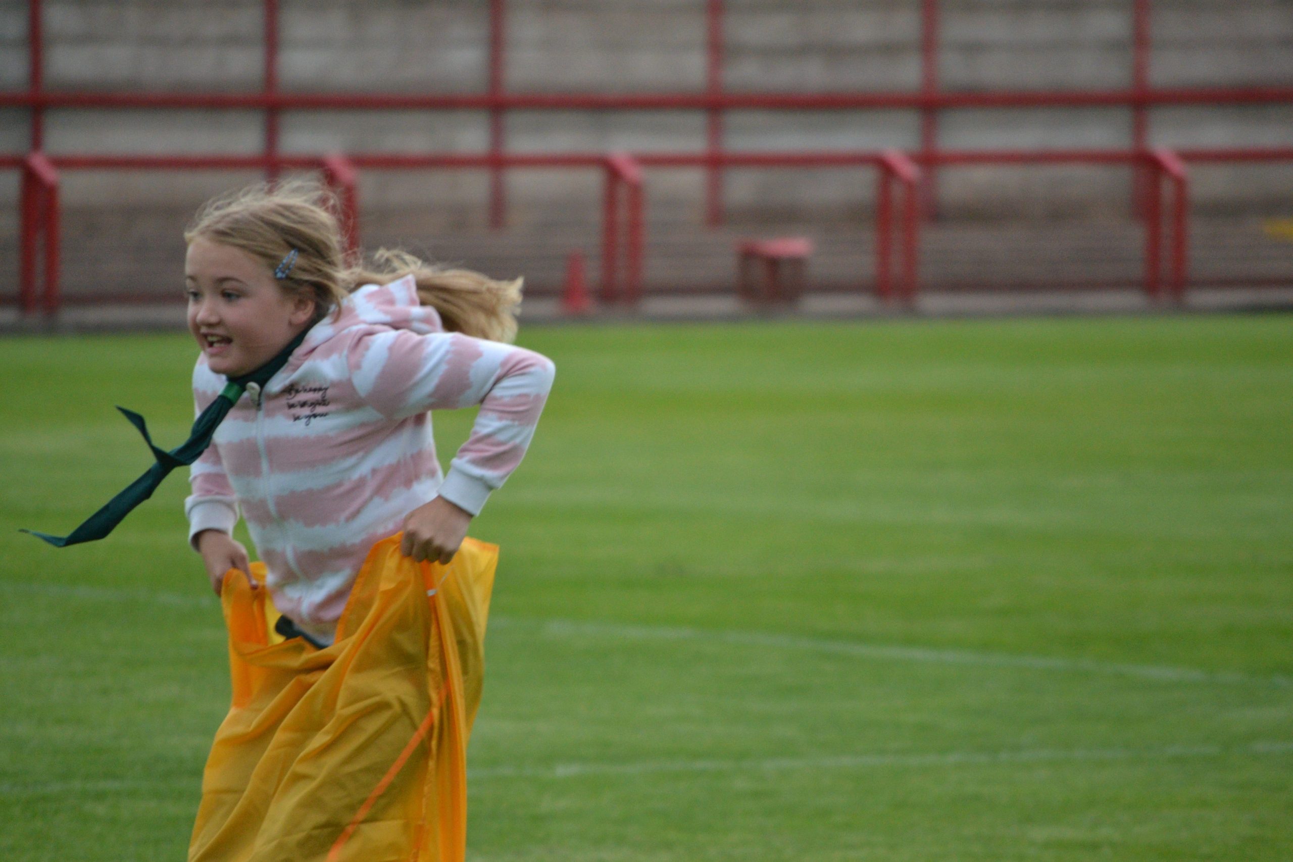 Cub Scout racing in sack race