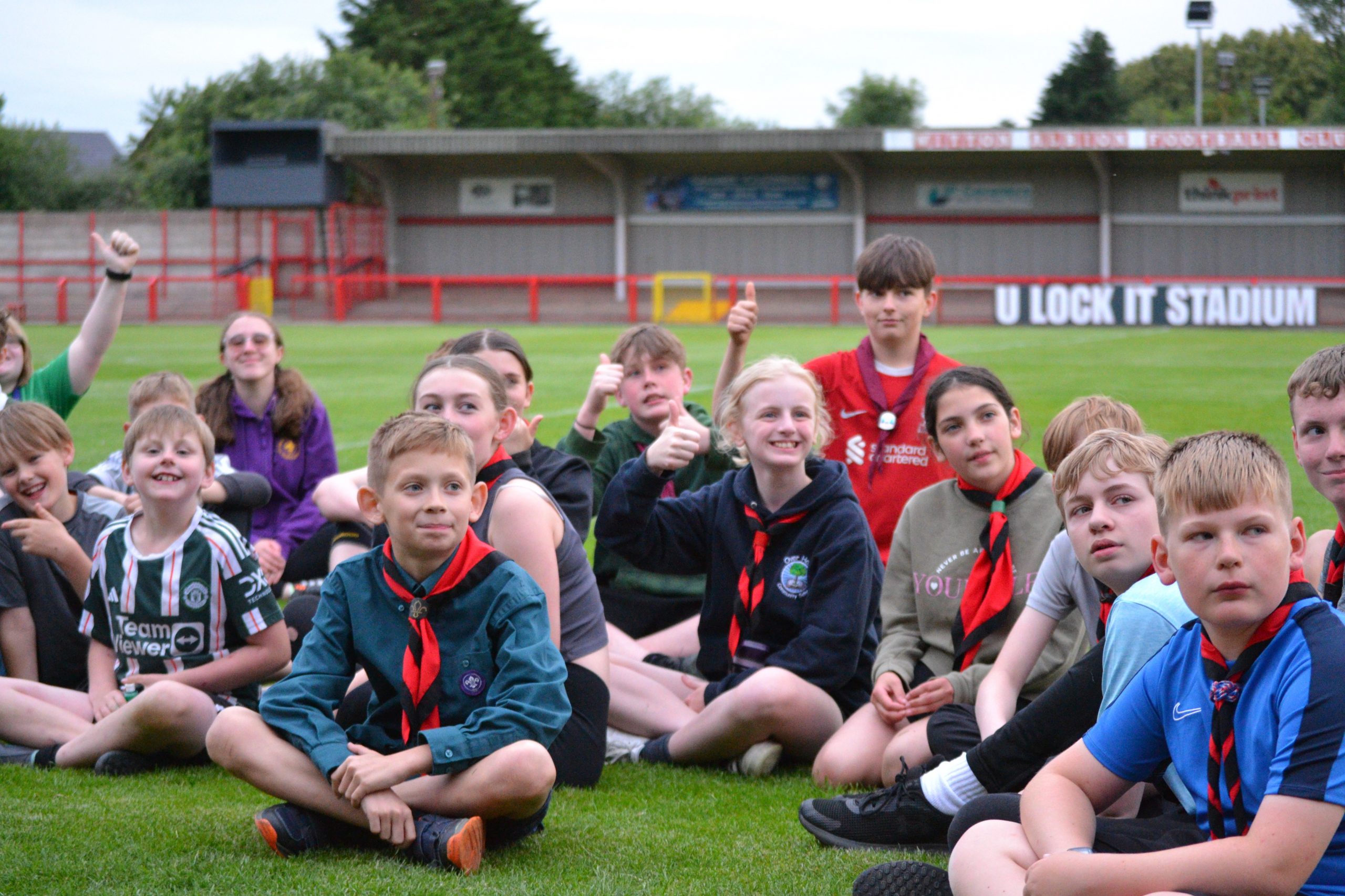 Group of Scouts listening in